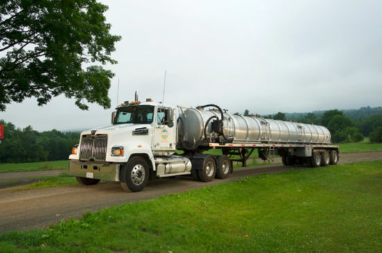 longtruck Agri-Cycle liquid waste tanker truck on a country road.