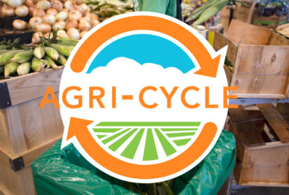 Agri-Cycle Logo with background of a grocer using a food waste bin.